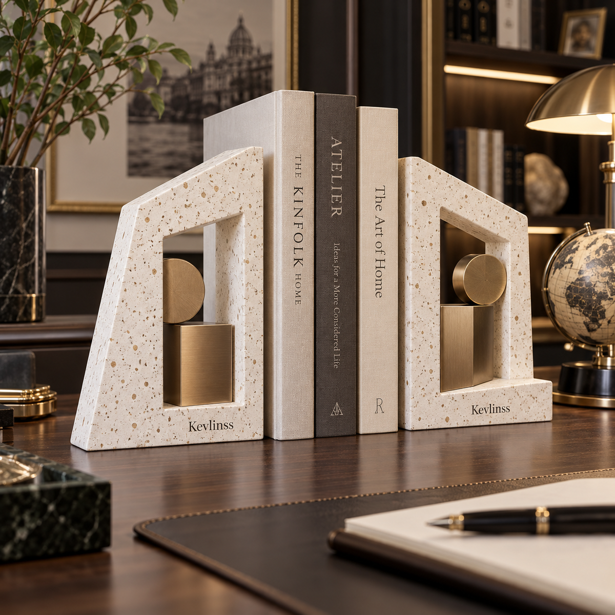 Pair of cream terrazzo-look arch bookends with gold-tone accents