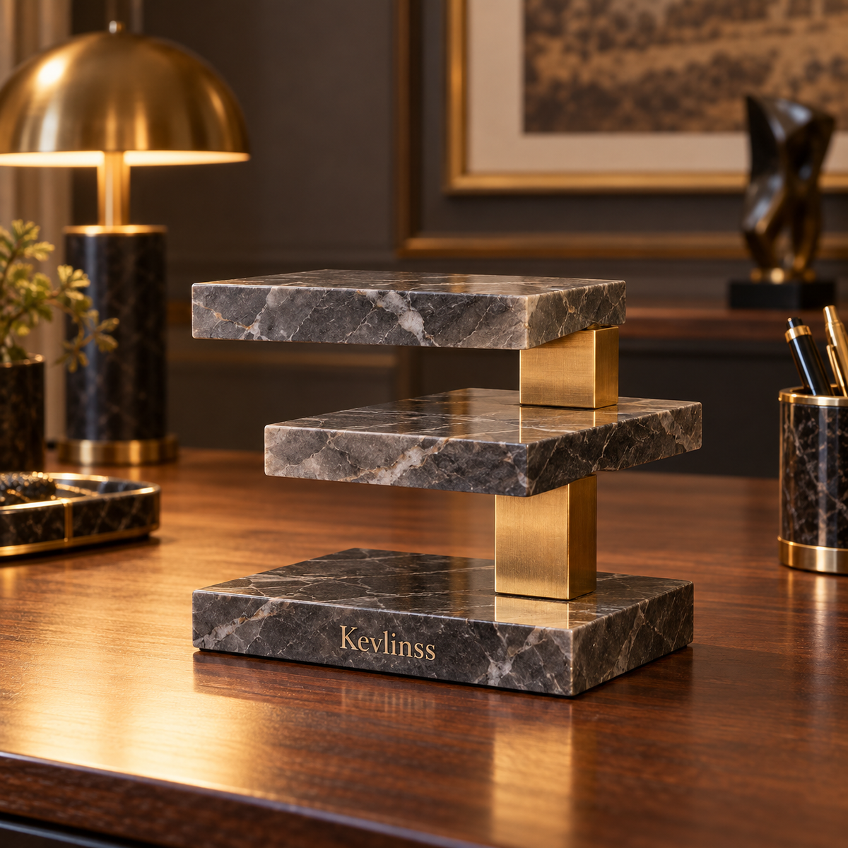 Three-tier marble-effect display riser with gold-tone supports